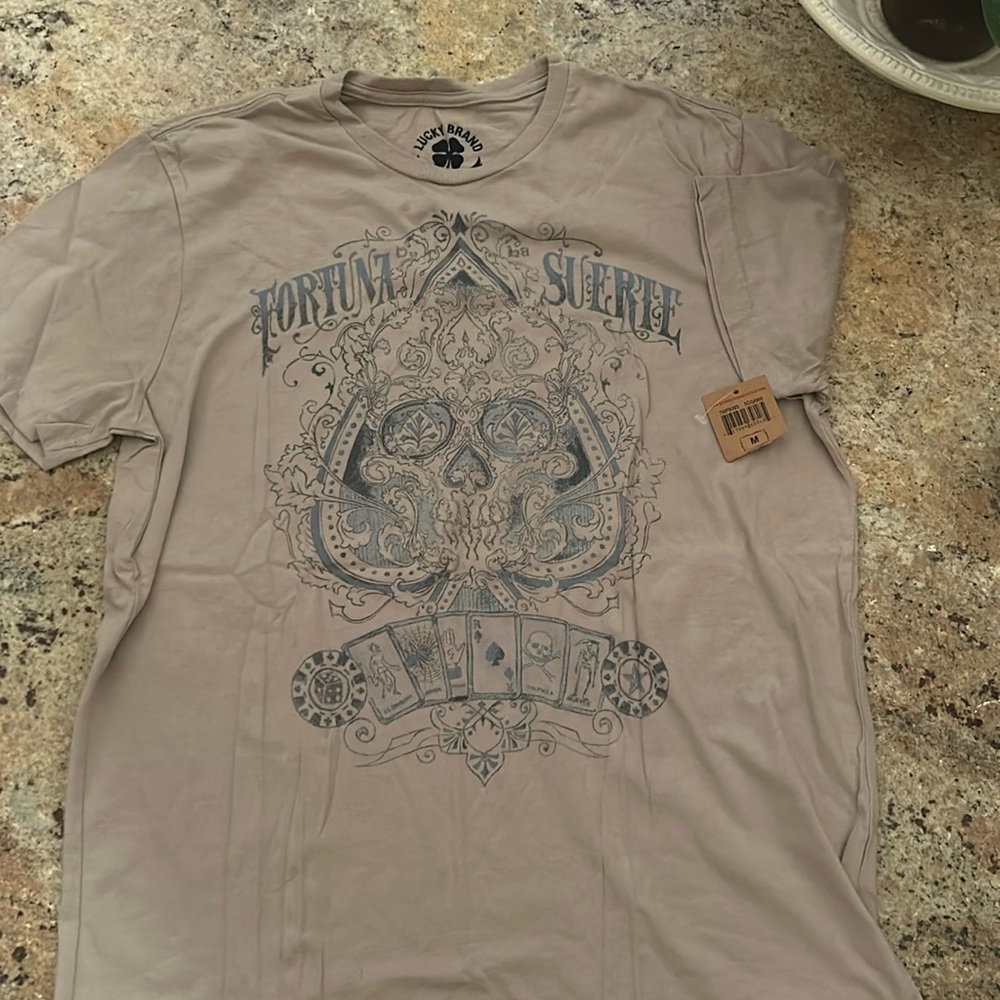 Brand new with tags, Vintage men’s Lucky Brand short sleeve tee